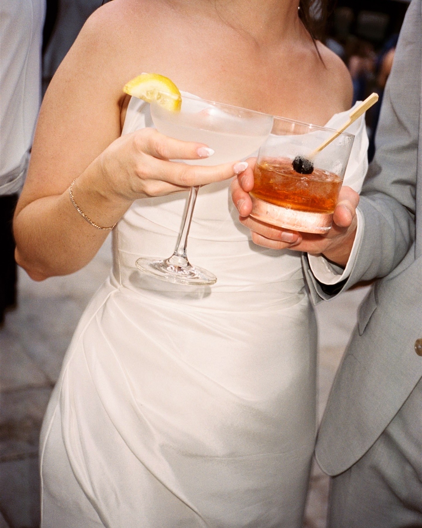 Details of newlyweds toasting their drinks
