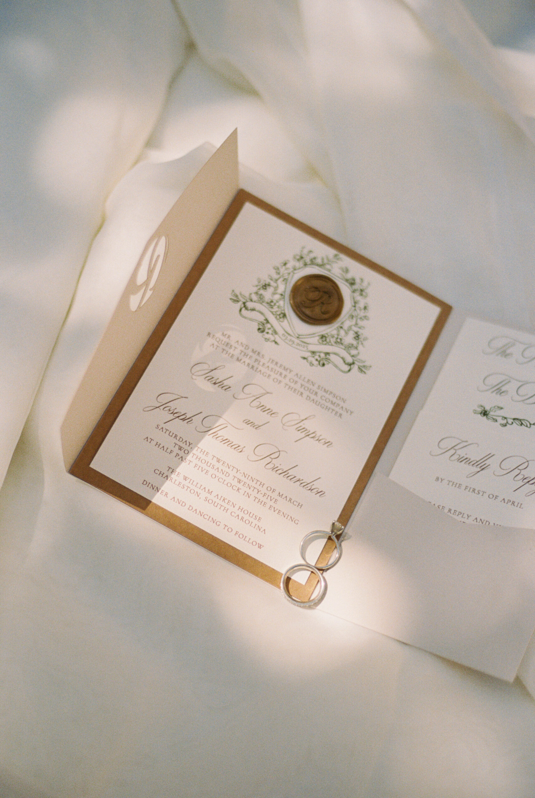 Details of a bride's rings on an invitation