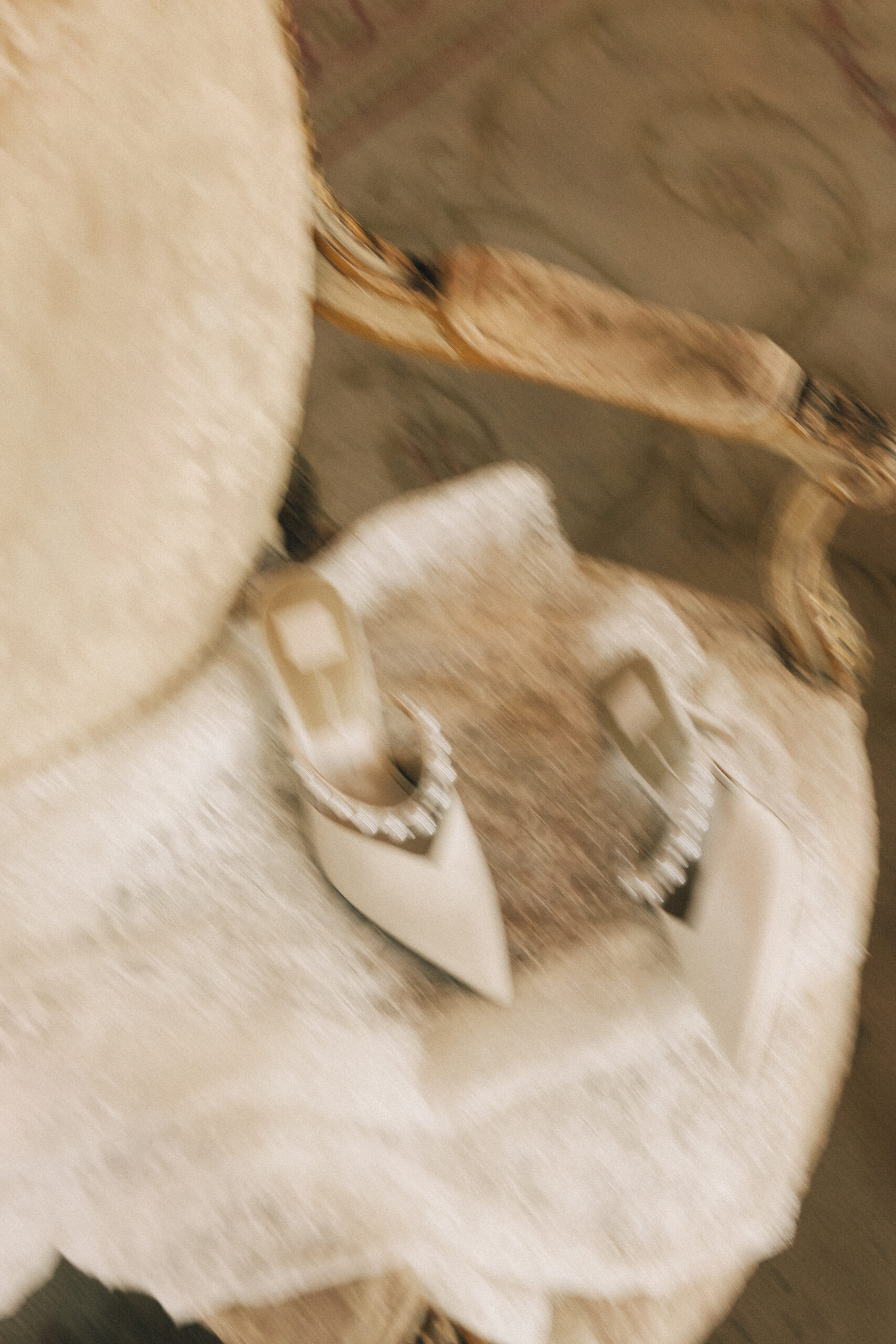 Details of a bride's shoes in a vintage chair