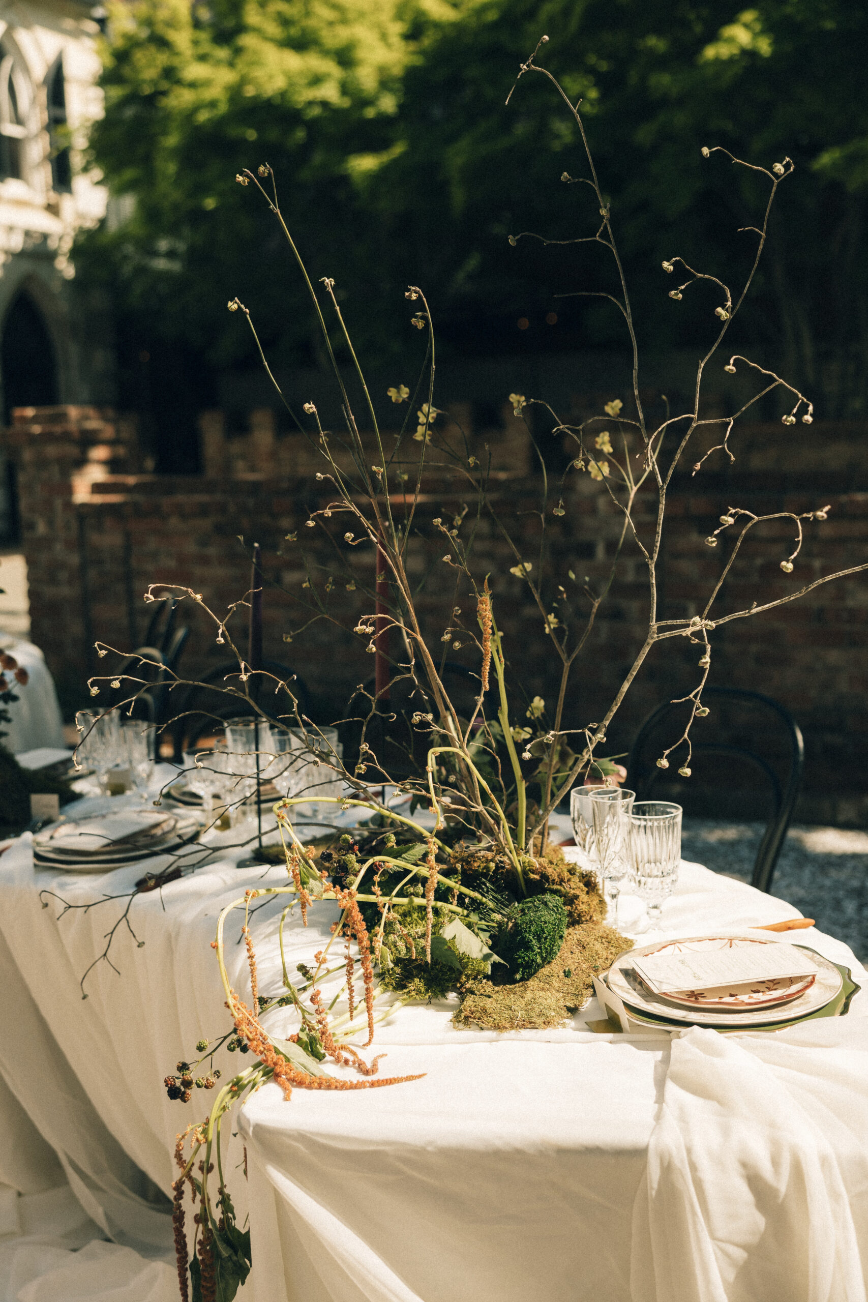 Details of a unique floral centerpiece on an outdoor reception table at one of the Charleston wedding venues
