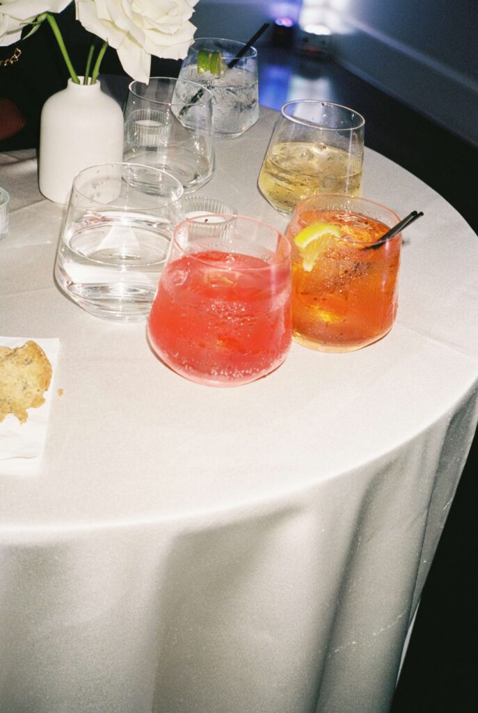 Details of colorful cocktails on a white table