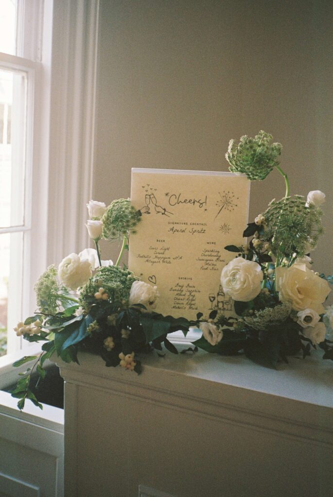 Details of a custom bar menu with white flowers
