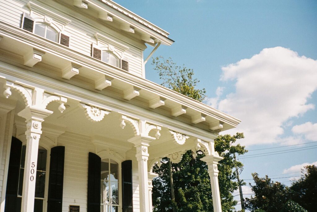 Details of the ornate woodwork on the merrimon wynne house wedding venue front porch