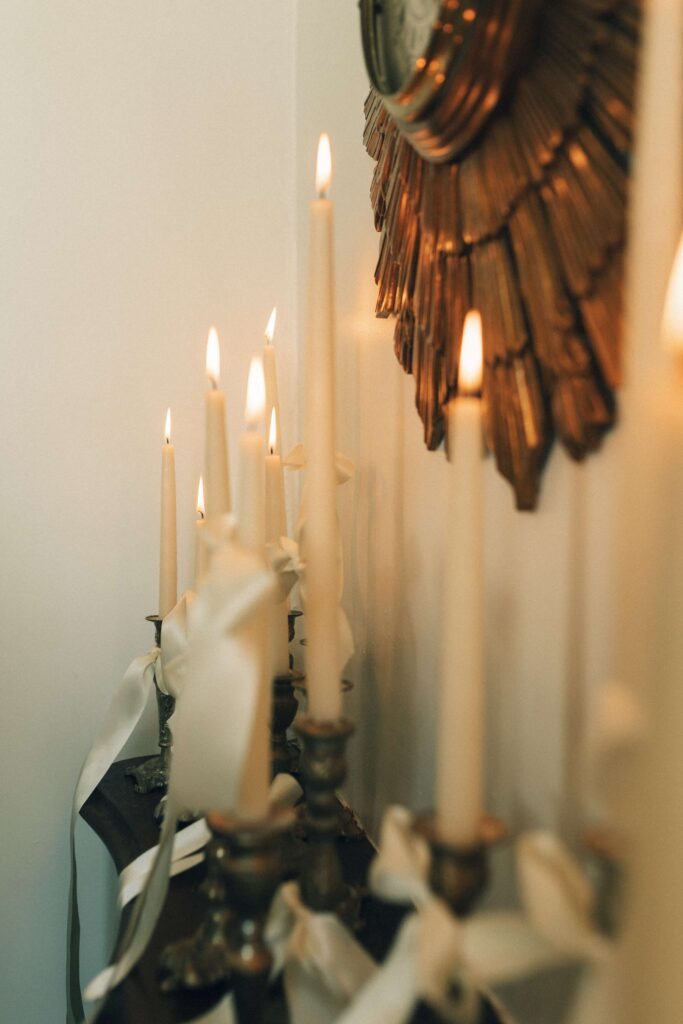 Details of candles at an entry table of the merrimon wynne house wedding venue