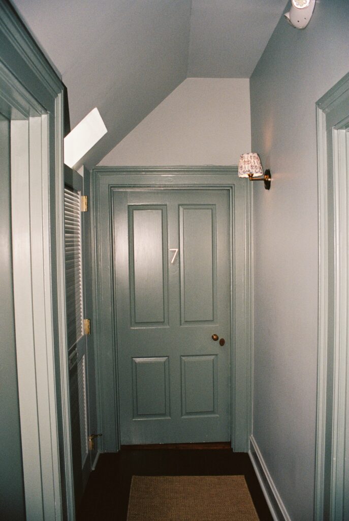 A peek down a hallway to the bridal getting ready suite door