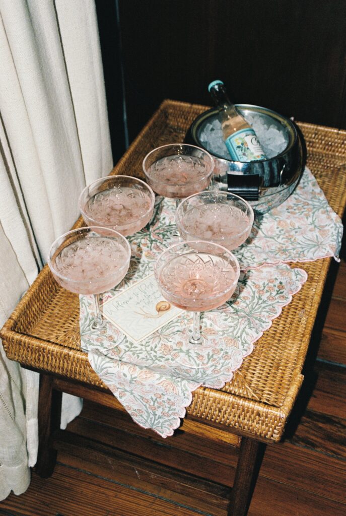 Details of pink drinks on a wicker side table