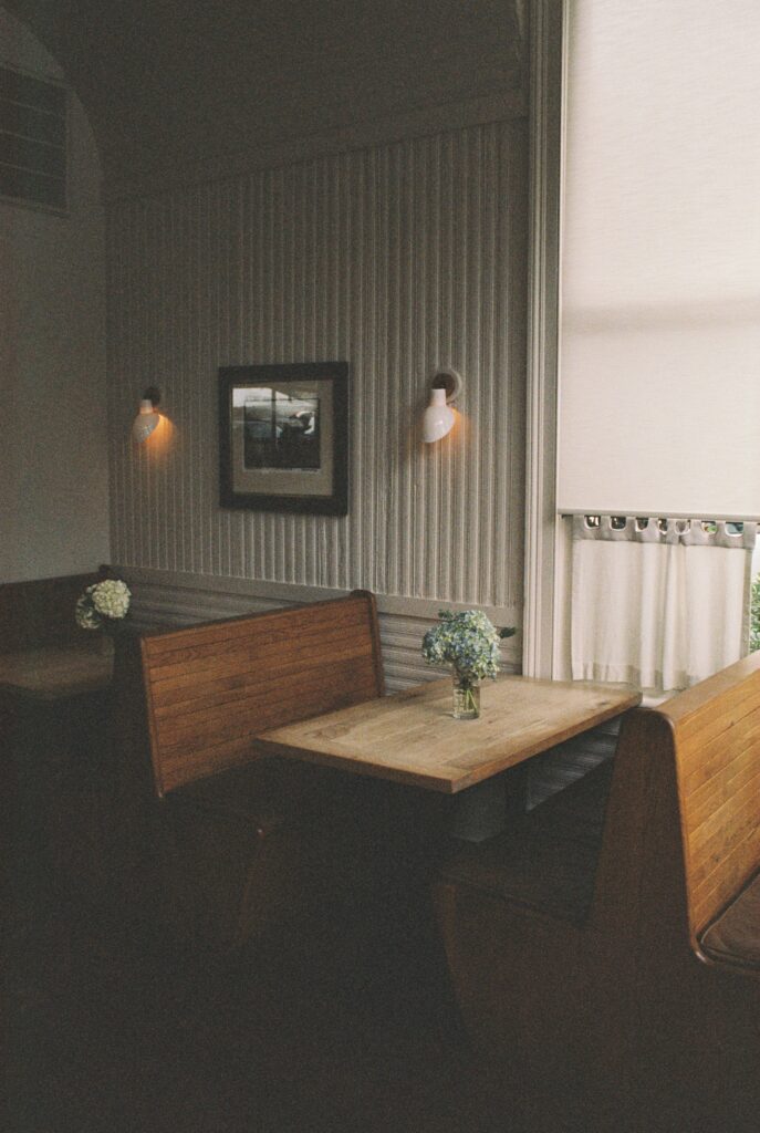 Details of wooden booth style table at the Post House Inn wedding venue