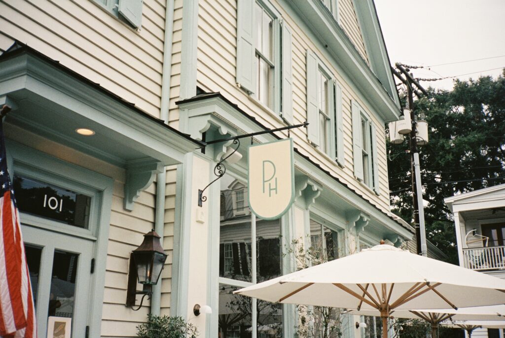 Details of the Post House Inn wedding venue sign hanging over the front patio