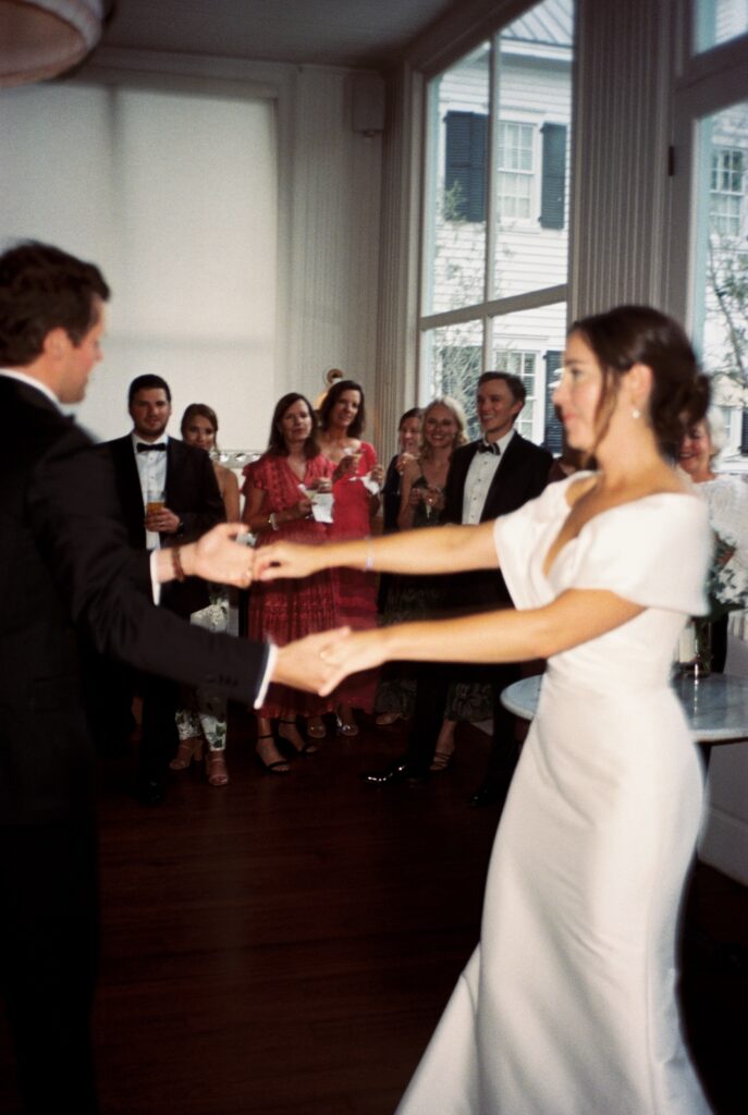 Guests admire the newlyweds as they dance for the first time