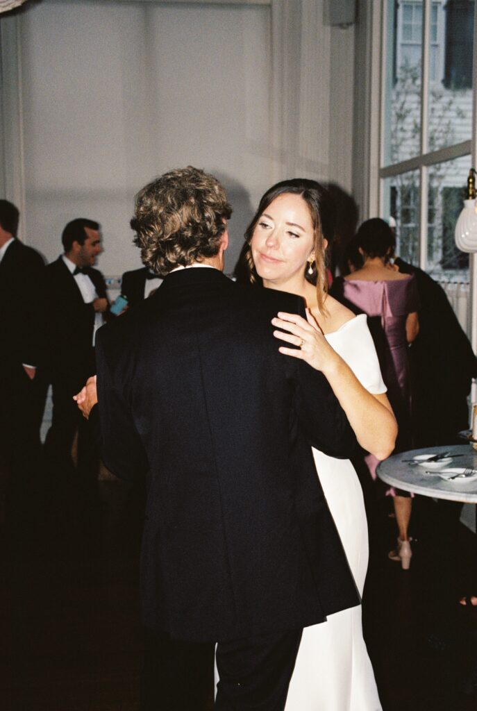 Newlyweds smile and dance among guests at their Post House Inn wedding