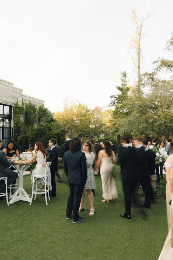A look at an active garden cocktail hour at one of the Wilmington wedding venues