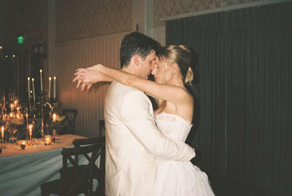 A bride and groom slow dance touching foreheads during their montage palmetto bluff wedding reception