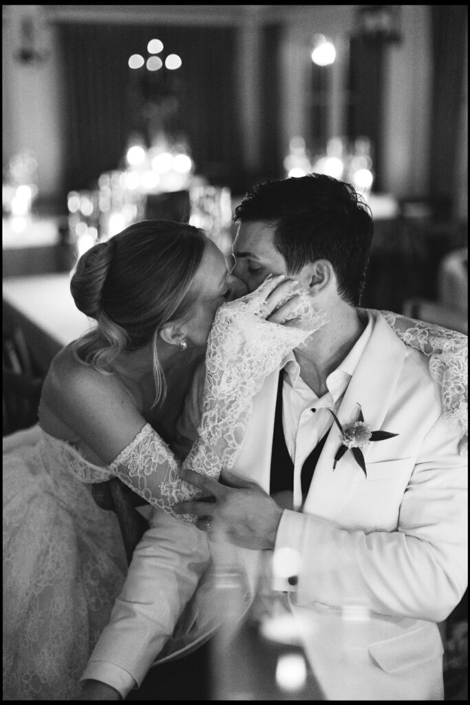 A bride kisses her groom with her hand on his cheekmontage palmetto bluff wedding