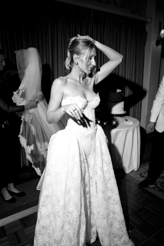 A bride dances with a hand in her hair at her reception at the montage palmetto bluff